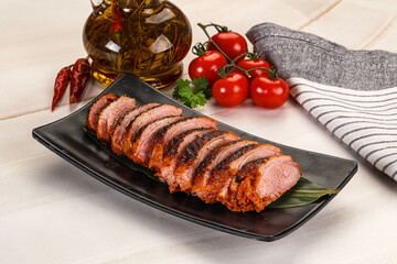 Sliced duck breast baked with cherry