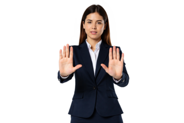 Serious young businesswoman dressed in a formal dark blue suit and white shirt, decisively holding up both hands with open palms facing forward in a universal 'stop', 'halt', or number 'ten' gesture