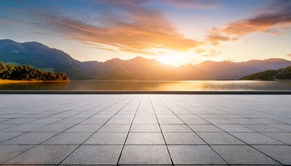empty square floor and lake with mountain natural landscape at sunset
