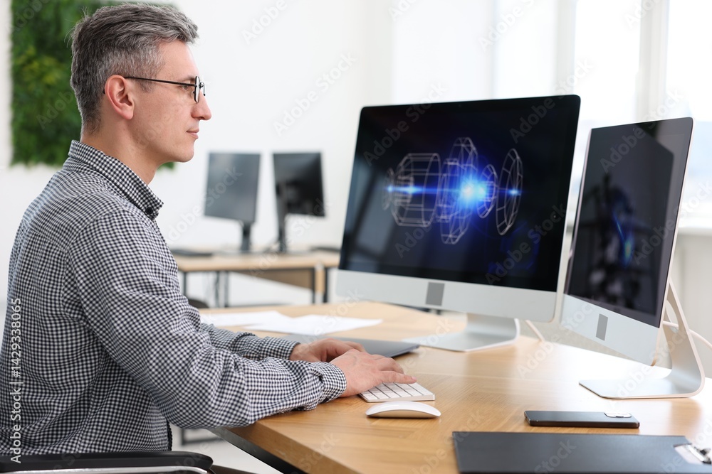 Poster engineer working with digital drawing at table in office