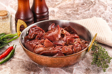 Raw uncokked chicken liver in the bowl