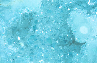 Blue Crystal Mineral Stone. Gems. Mineral crystals in the natural environment. Texture of precious and semiprecious stones. Seamless background with copy space colored shiny surface of precious stones