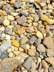 A pile of rocks and pebbles on a beach