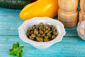 Pickled canned capers in the bowl