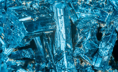 Blue Crystal Mineral Stone. Gems. Mineral crystals in the natural environment. Texture of precious and semiprecious stones. Seamless background with copy space colored shiny surface of precious stones