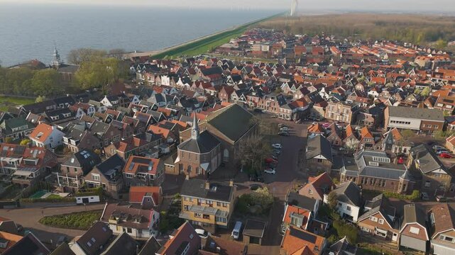 Aerial drone video of the church in the town center of Urk, the Netherlands.