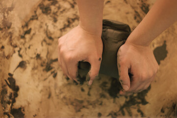 Pottery artist making a shape from clay. Shallow DOF. Developed from RAW; retouched with special...