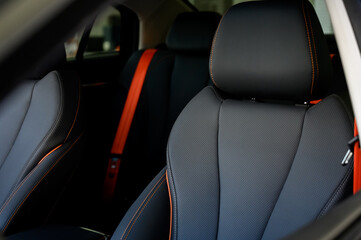 Interior of a modern car with black leather seats