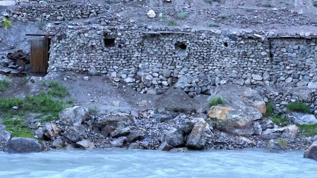 Old villages in Tajikistan. Tajikistan's road along the Zeravshan River near the Pamir highway. Old stone villages in the mountains of the Silk Road. 4К