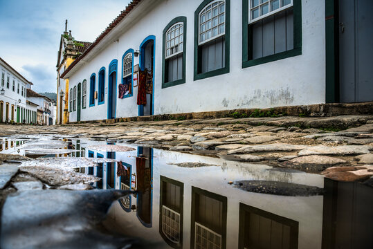 Puddle Reflection of Colonial Houses in Paraty Historic Center - Brazil