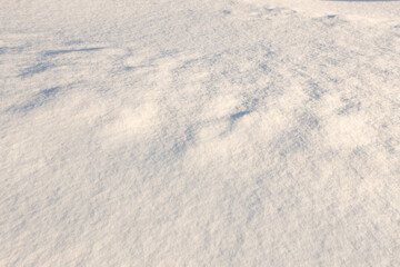 Natural snow texture,  surface of clean fresh snow. Snowy ground. Winter background,  Christmas and New Year design