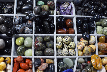 Semi-precious natural stones at the exhibition and sale of stones. Amethysts, jasper, black onyx,...