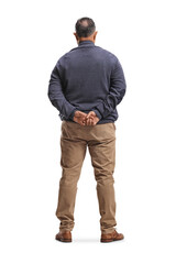 Naklejka premium Rear view shot of a man standing with arms behind back