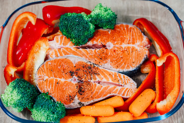 Delightful salmon fillets with vibrant vegetables ready for a healthy meal preparation