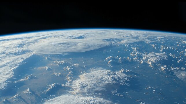 Stunning panoramic view of Earth from space showcasing the planets curvature, vibrant blue oceans, white fluffy clouds, brown landmasses and an atmospheric layer connecting the surface - Powered by Adobe