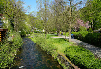 Bad Schandau, Germany, Spa park and pedestrians and tourists Kirnitzsch river