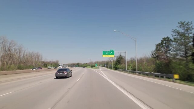 Car traffic driving on multiple lanes highway and interstate 315 and 270 belt outside Columbus, Ohio in midwest American roadway turnpike near northern city traffic by Worthington, OH
