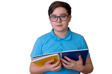 Young caucasian male teen holding notebooks in blue shirt isolated on black background