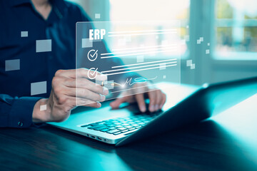 Business people using a laptop with document management for ERP. Enterprise resource planning concept,Enterprise Resource Management ERP software system for business resources plan presented.