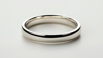 Simple platinum wedding band with beveled edges, isolated on white background