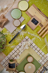 Color palette mood board in green and yellow with floral decoration for interior design and decor, top view