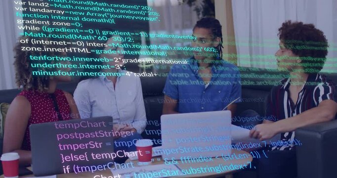 Four coworkers sitting around low office table using silver laptop, showing floating code overlays