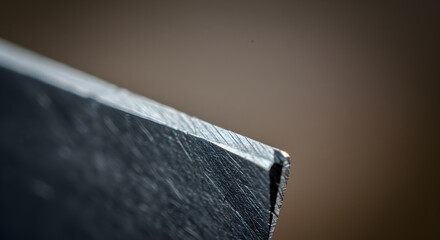 Macro View Of Blade Edge Showing Sharpening Marks And Reflective Bevel
