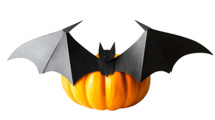 Paper bat lying on pumpkin