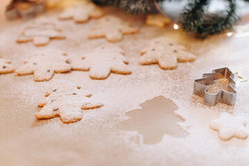 handmade Christmas gingerbreads from dough on table