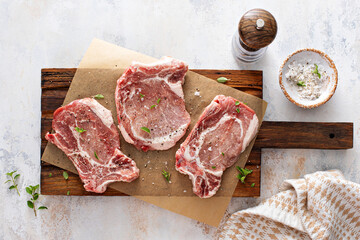 Pork chops on a bone ready to be grilled or seared