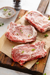 Pork chops on a bone ready to be grilled or seared