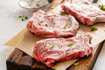 Pork chops on a bone ready to be grilled or seared