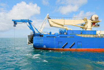 Side View of Cable Laying Vessel with ROV Deployment and Heavy Lift Crane Offshore
