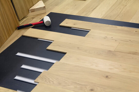 Mallet and laminate boards on floor