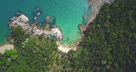 Capturing breathtaking aerial views of a tropical island with crystal-clear turquoise waters...