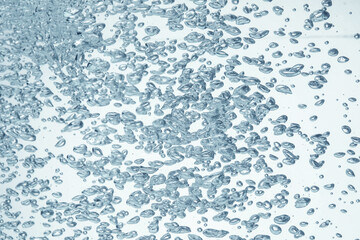 Soda water with bubbles as background, closeup