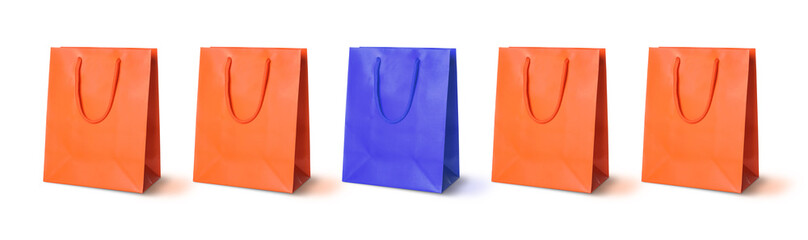 Different, unique, special. Blue shopping bag among orange ones on white background