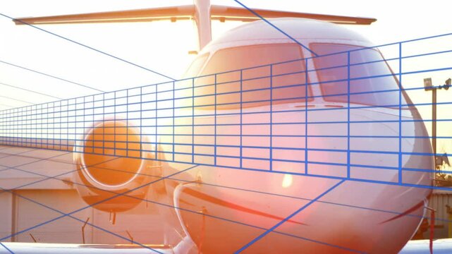 White private jet nose occupying apron featuring engine inlet and cockpit windows over blue grid