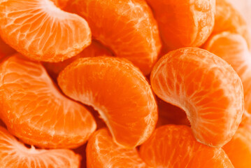 peeled tangerine slices, food background, delicious fruits, useful citrus vitamins concept,...