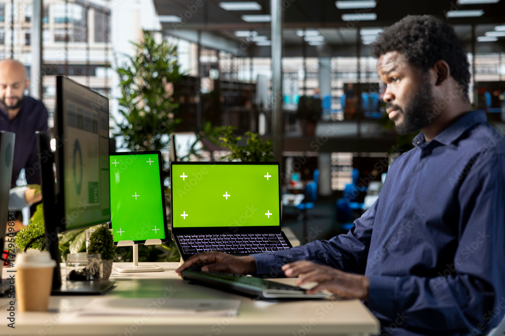 Poster african american employee uses green screen and evaluating performance metrics, working with statist