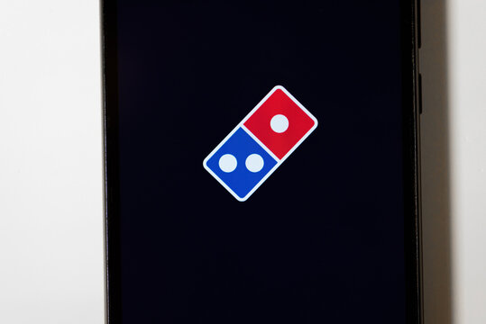 KIROV, RUSSIA - APRIL 12, 2025 domino pizza icon on smartphone display, mobile application for food pizza delivery, digital life and technologies, background, copy space