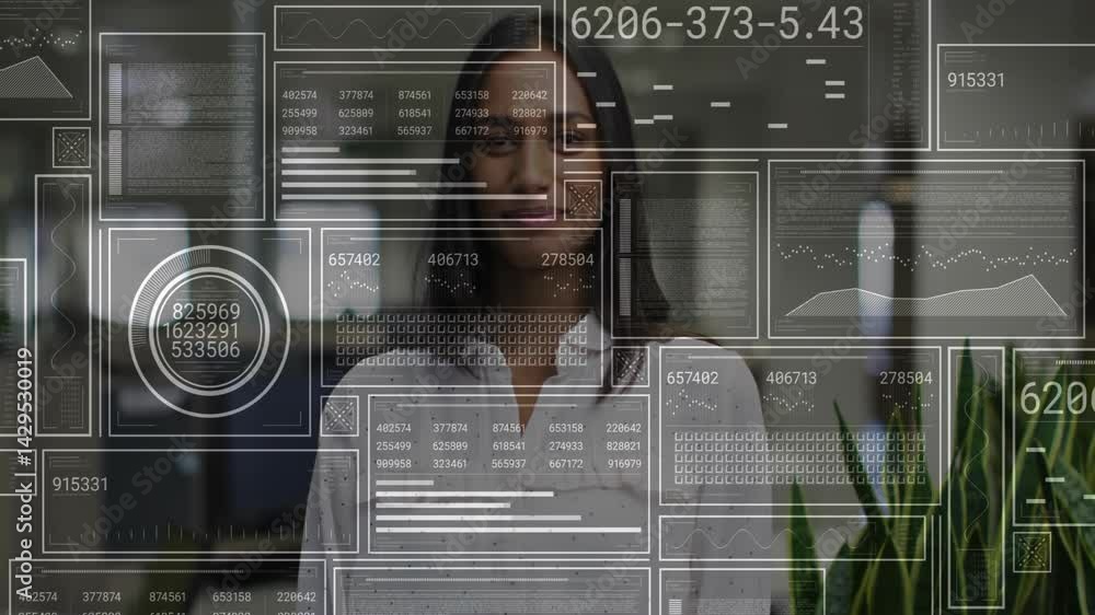 Poster woman interacting with digital interface in tech office displaying line graphs and code blocks