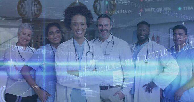 Medical team in scrubs standing in hospital corridor, displaying binary code and graph overlays - Powered by Adobe