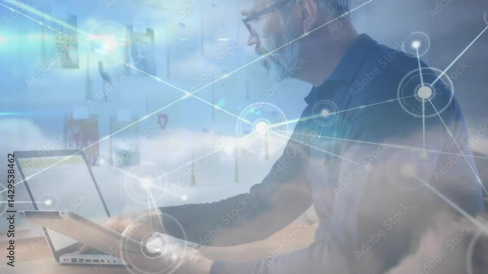 Poster it specialist working on laptop in office with animated cloud overlay connecting network nodes