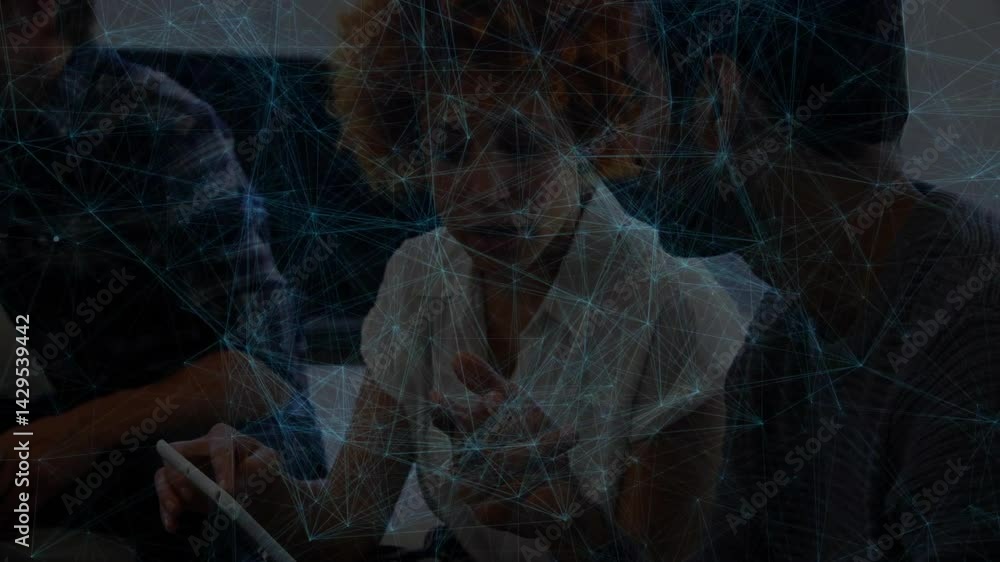 Poster coworkers leaning around tablet, tapping screen while blue network lines mapping business data flow