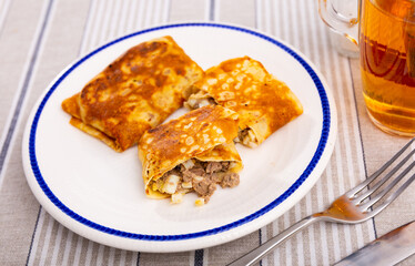 Delectable pancakes, featuring filling of minced liver and eggs, perfect for your next breakfast