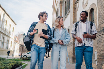 University students walking and talking on campus
