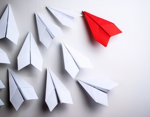 Fototapeta premium Red paper airplane leading white fleet: innovation and leadership concept
