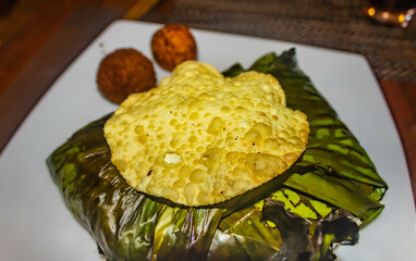 Lamprais, a Sri Lankan meal,  steamed and packed in a banana leaf