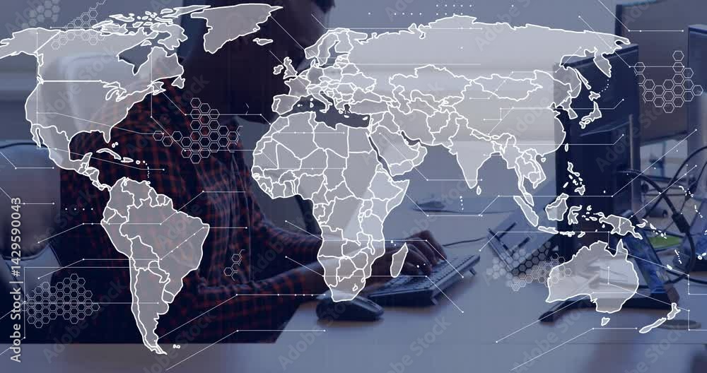 Poster software developer typing at keyboard in modern office, overlaying global map with hexagon data